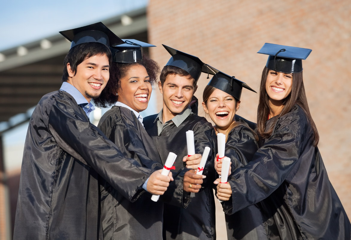Graduates in a line holding diplomas