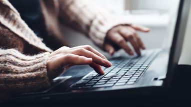 Woman typing on laptop